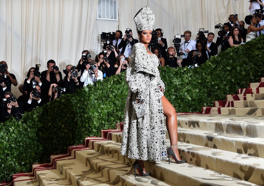 Rihanna at the 2018 Met Gala: See How She Interpreted the Heavenly Bodies Theme.
