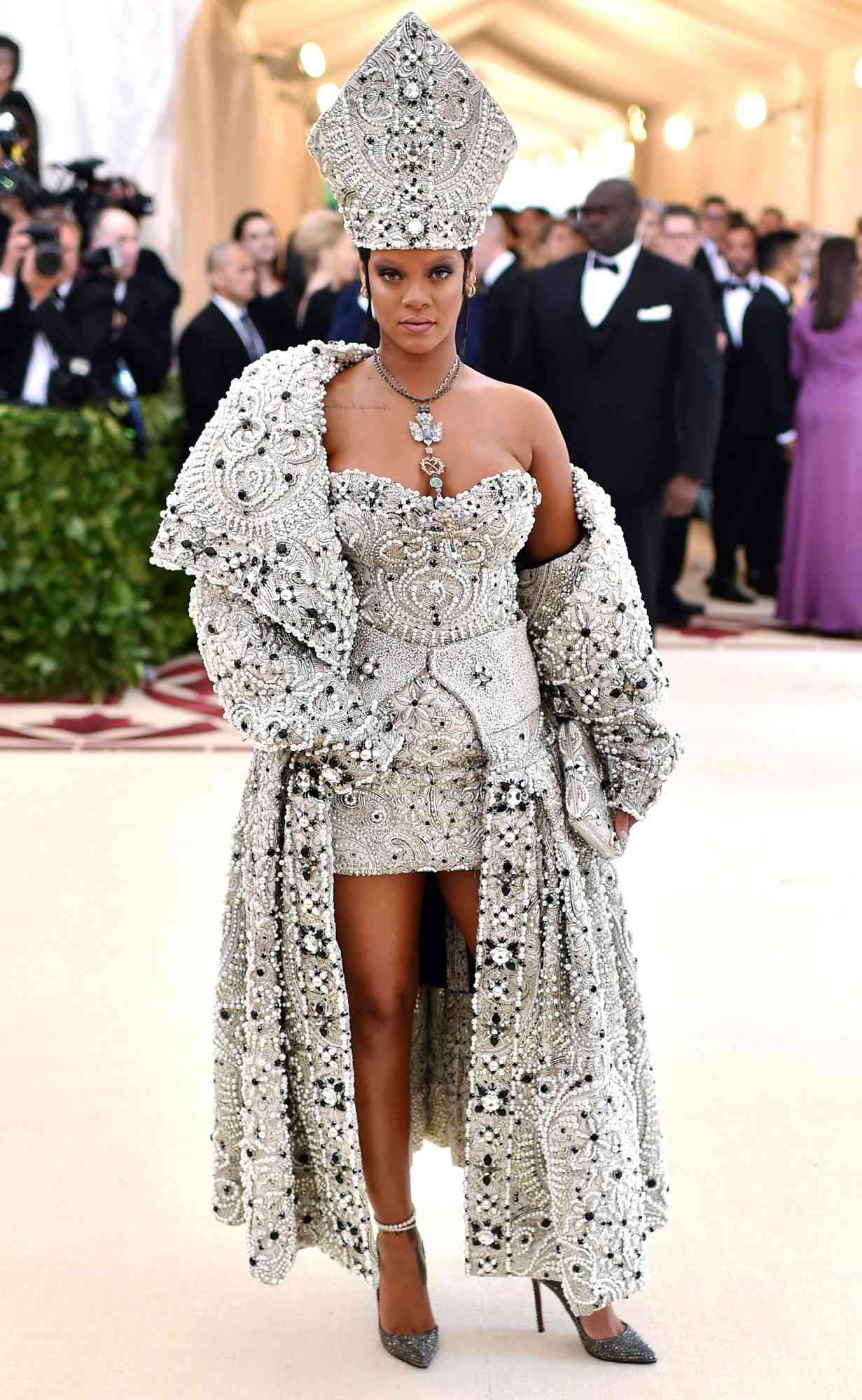 Rihanna at the 2018 Met Gala: See How She Interpreted the Heavenly Bodies Theme.