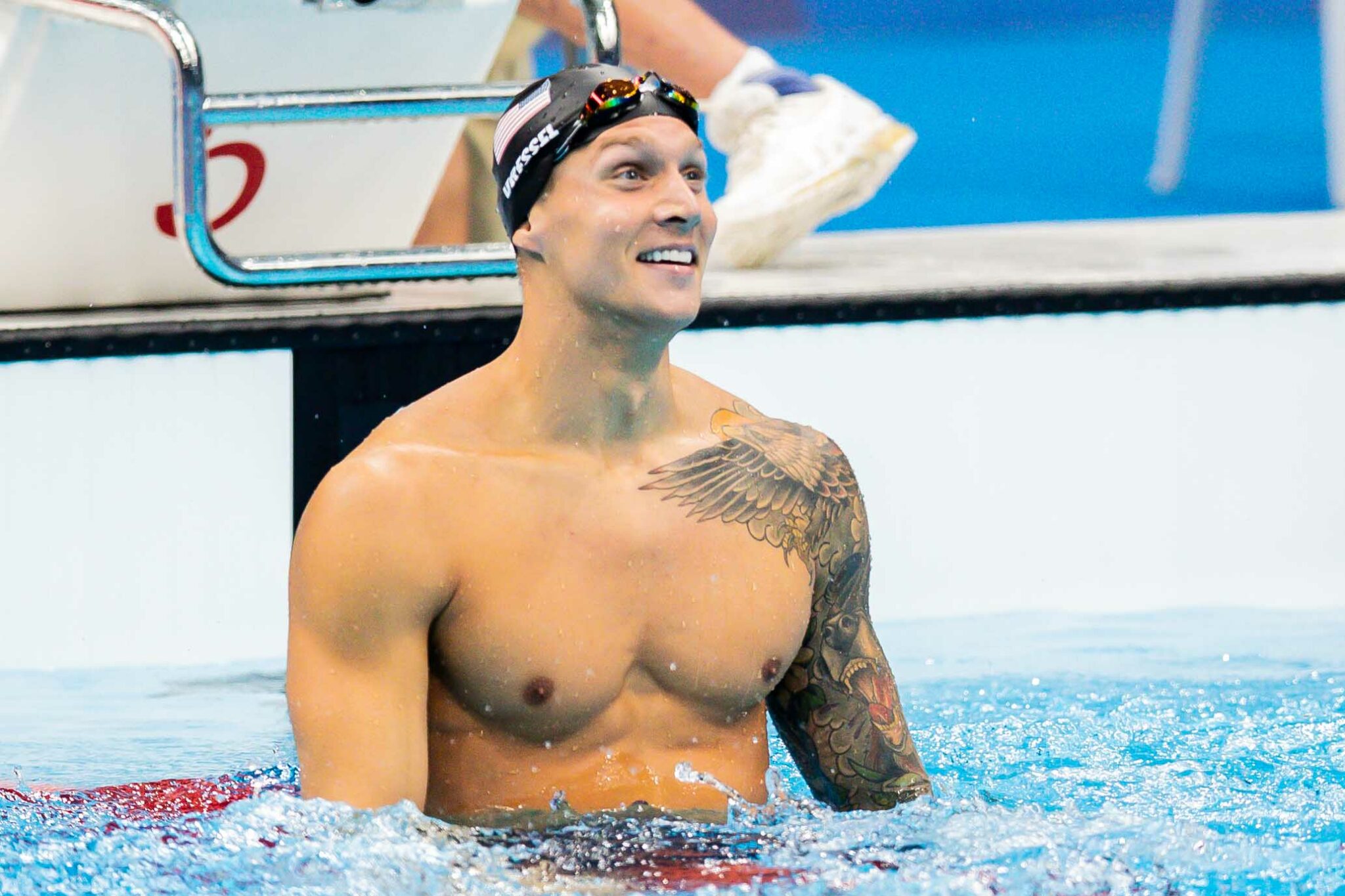Why does Caeleb Dressel wear that arm sleeve in the pool? We explore the reasons behind this choice for elite swimmers during major races.