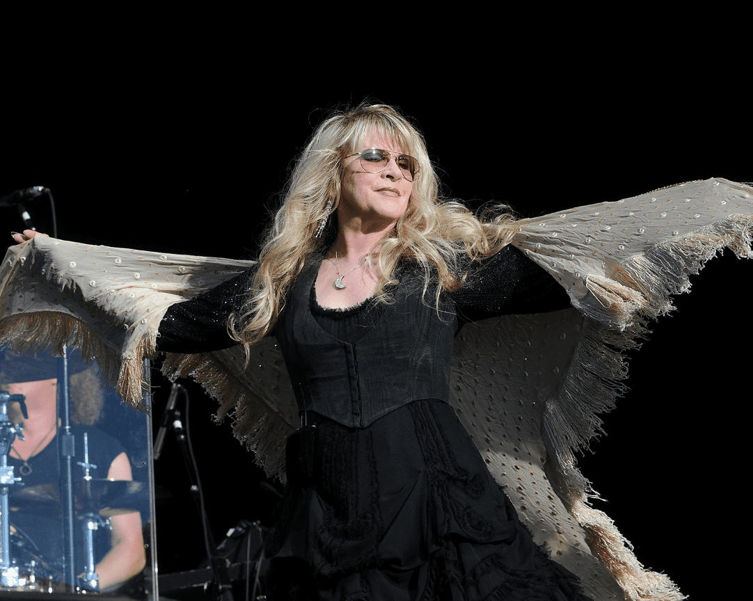 What are the most iconic Stevie Nicks outfits? See photos of her unforgettable stage looks.