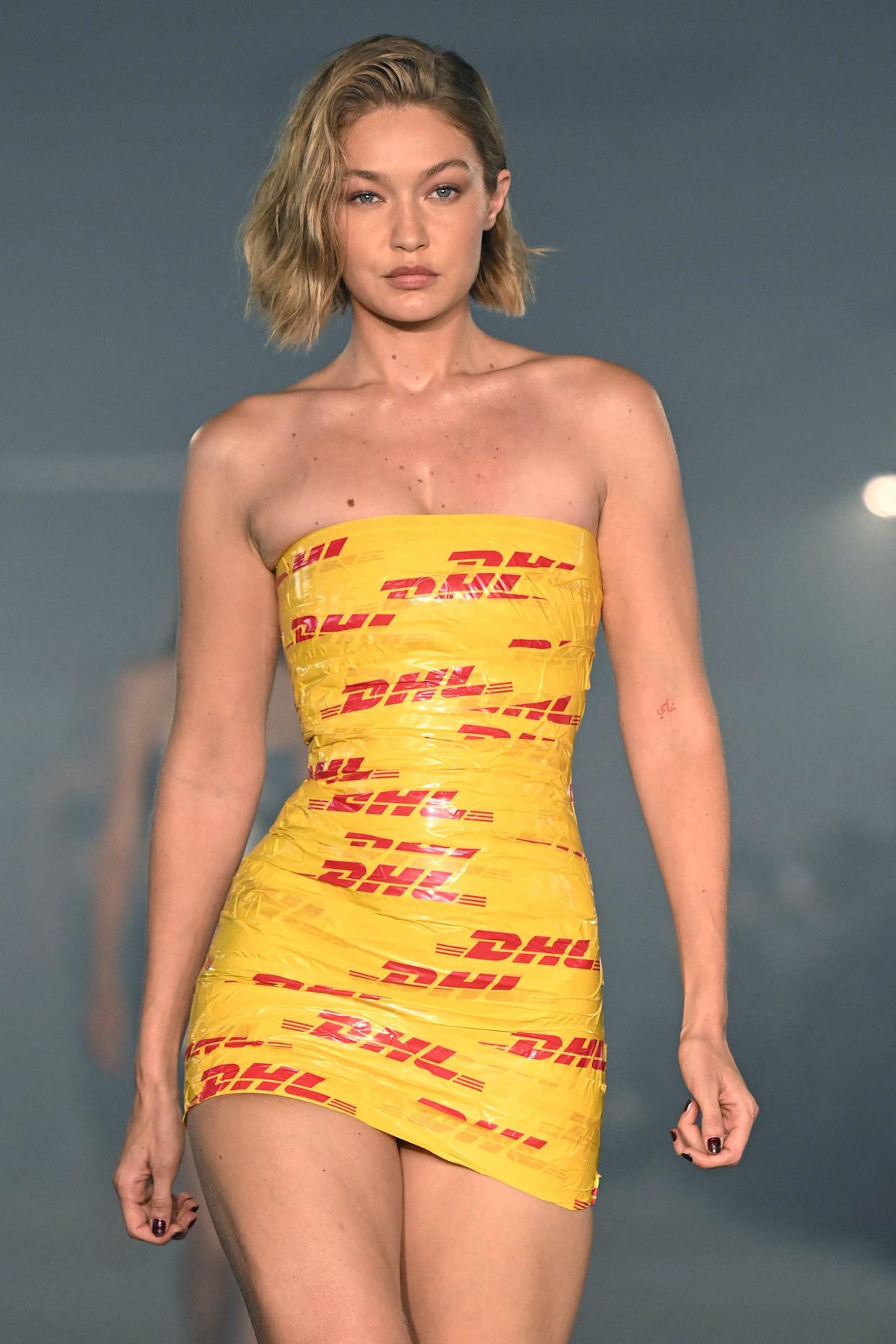Get inspired by the Gigi Hadid DHL dress: Check out how this bold outfit made fashion history.